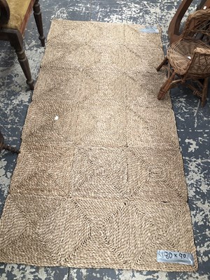 Lot 1663 - A natural fiber rug, 180 x 90cms