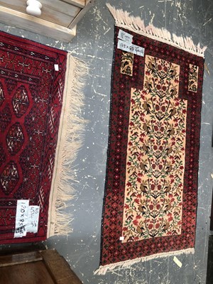 Lot 1666 - Three Oriental rugs, a prayer rug, 125 x 68cms,...