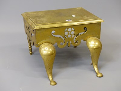 Lot 1463 - A brass footman with a rectangular top,...