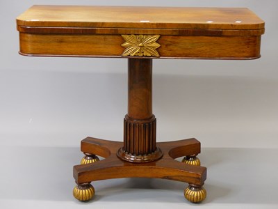 Lot 1466 - A 19th century rosewood swivel top games table...