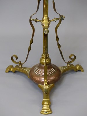 Lot 1479 - A brass floor standing oil lamp converted to...