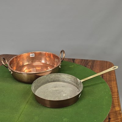 Lot 1489 - A copper two handled jam pan together with a...