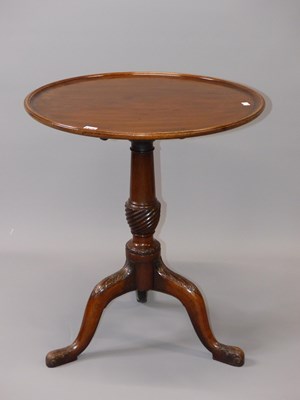 Lot 1528 - A 19th century mahogany tripod table with a...