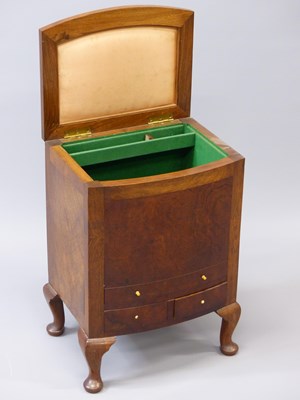 Lot 1529 - An early 20th century walnut bow front cabinet...