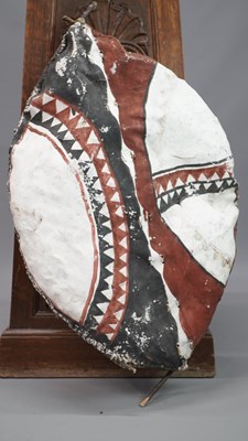 Lot 1533 - A Masai leather shield painted geometrically...