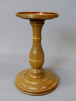 Lot 1539 - A mahogany table top torchere, the dished...