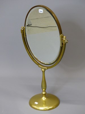 Lot 1540 - A brass framed oval dressing table mirror...