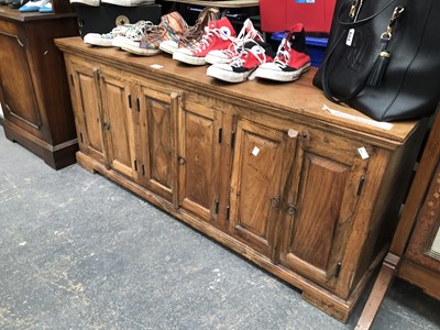 Lot 458 - A teak side cabinet
