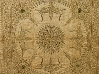 Lot 1550 - A framed Indian beige silk panel sewn in gold...