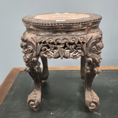 Lot 1563 - A Chinese marble topped hardwood stand, the...