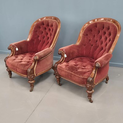 Lot 154 - A pair of Victorian carved walnut button-back...