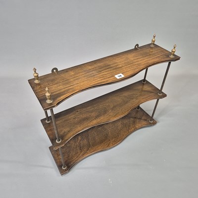 Lot 58 - A vintage mahogany and brass Regency style...