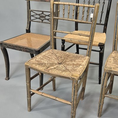 Lot 61 - A group of four Regency chairs retaining...