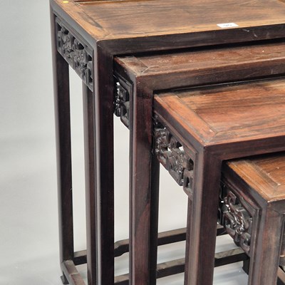 Lot 90 - A nest of four Chinese carved hardwood tables...