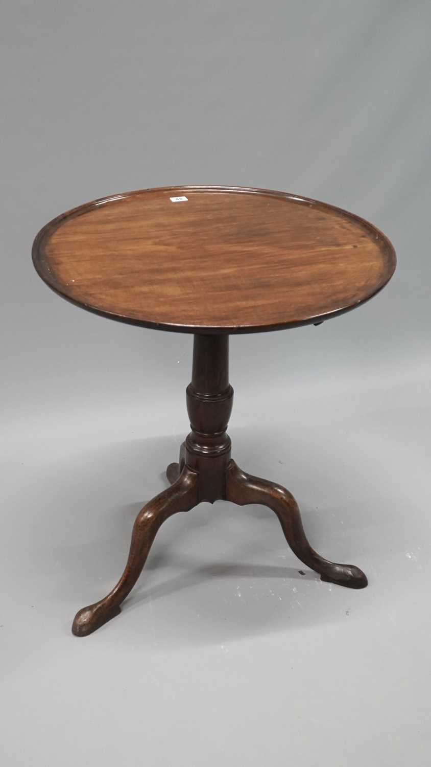 Lot 48 - A Georgian and later carved mahogany tilt top...