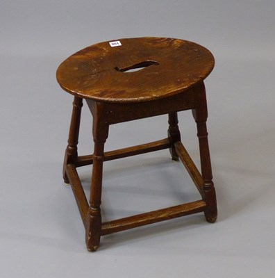 Lot 100 - A Georgian oak joint stool oval pierced top,...