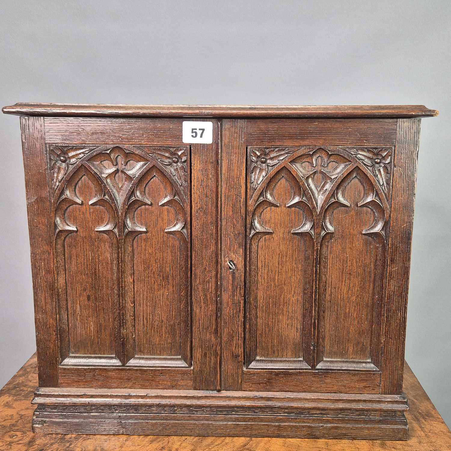 Lot 57 - A Victorian carved oak Gothic revival table...