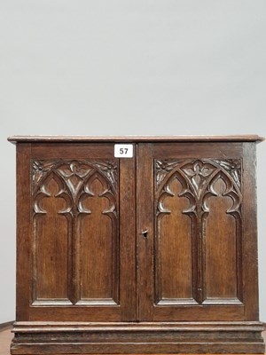 Lot 57 - A Victorian carved oak Gothic revival table...