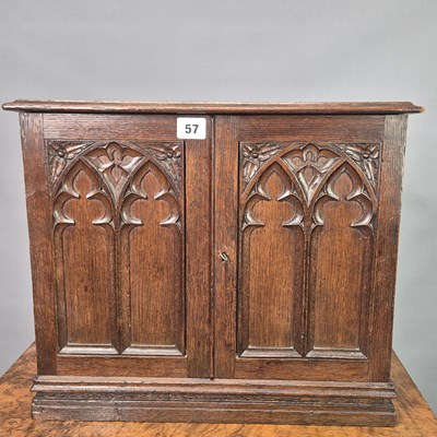 Lot 57 - A Victorian carved oak Gothic revival table...