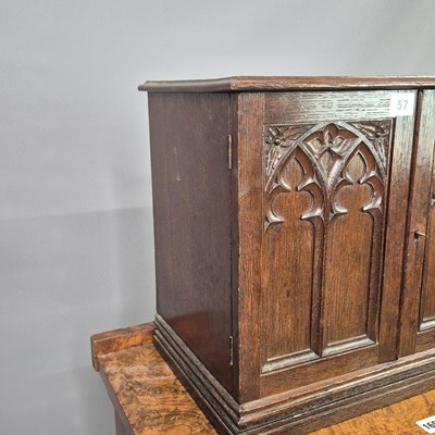 Lot 57 - A Victorian carved oak Gothic revival table...