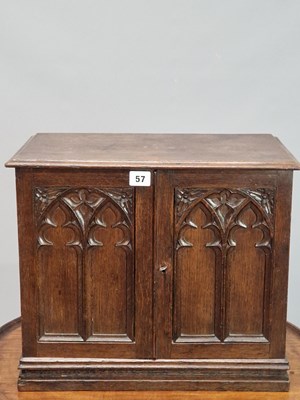 Lot 57 - A Victorian carved oak Gothic revival table...