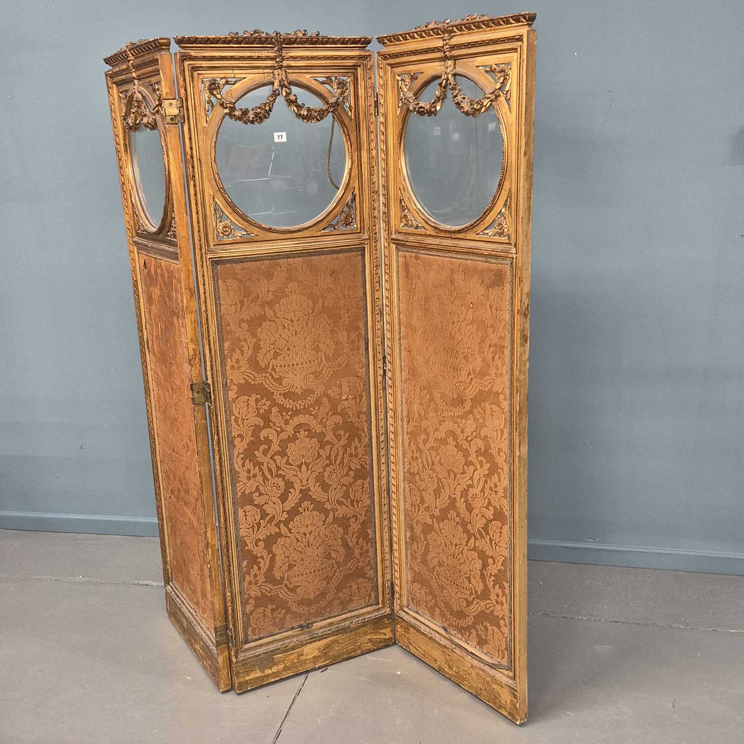 Lot 77 - An antique French carved giltwood three-panel...
