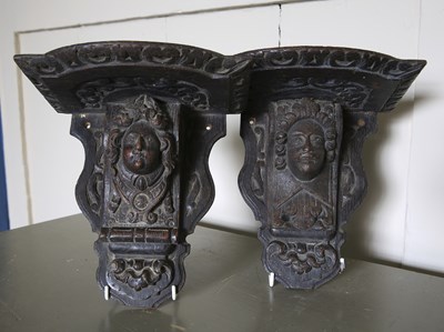 Lot 181 - Two antique carved oak wall brackets in...