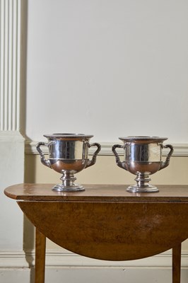 Lot 211 - A pair of regency twin hand;e wine coolers. ...