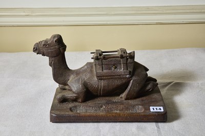 Lot 114 - An antique carved colonial hardwood camel form...