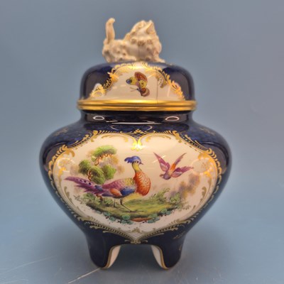 Lot 1573 - A Royal Worcester blue ground vase painted...