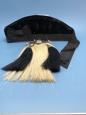 Lot 1588 - A black velvert glengarry together with a...