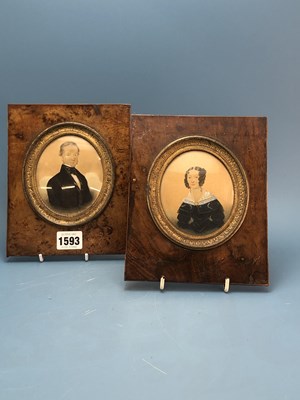 Lot 1593 - A pair of yew wood framed portrait miniatures...