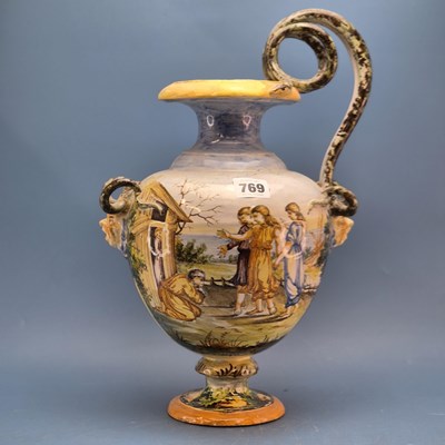 Lot 769 - A 19th century majolica baluster ewer painted...