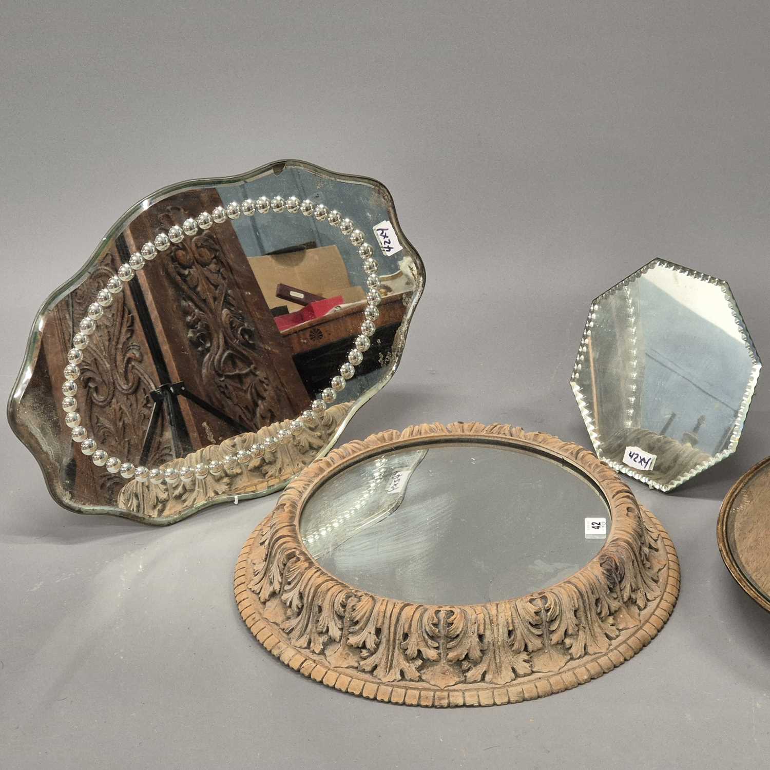 Lot 42 - A group of four table centres, including a...