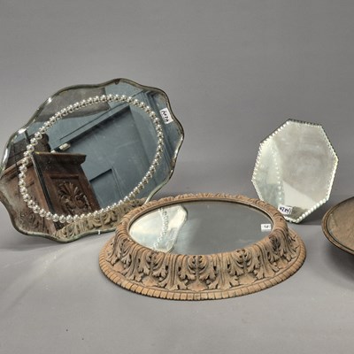 Lot 42 - A group of four table centres, including a...