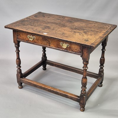 Lot 1612 - An 18th century oak side table with a drawer...