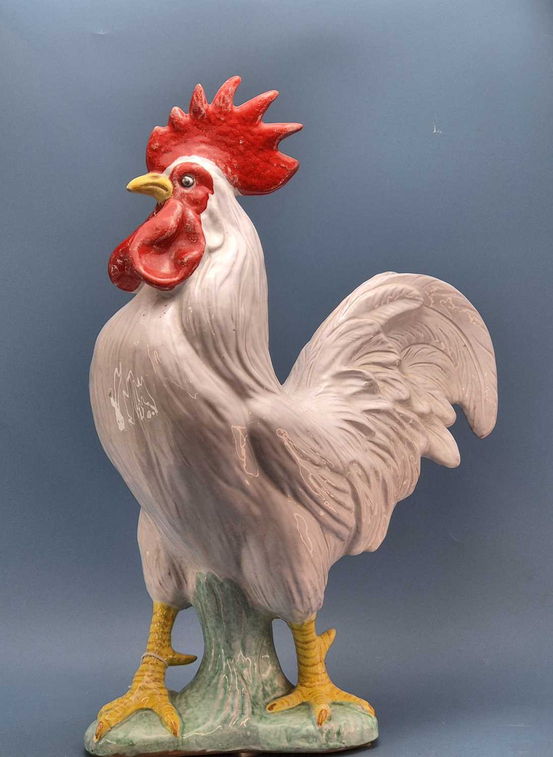 Lot 49 - A large Italian pottery polychrome figure of a...