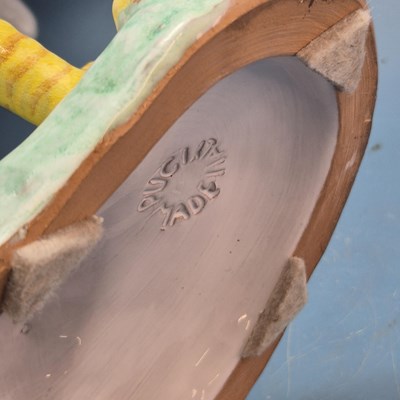 Lot 49 - A large Italian pottery polychrome figure of a...