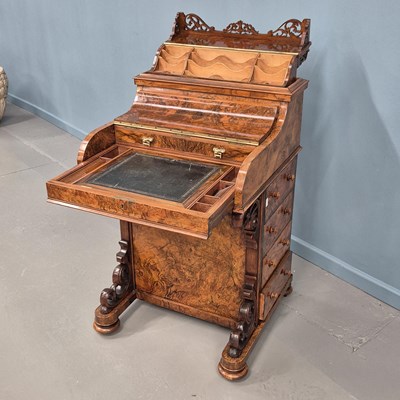 Lot 1616 - A Victorian burr walnut piano top davenport...