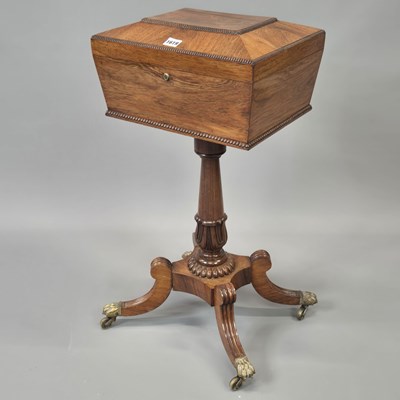 Lot 1619 - A 19th century rosewood teapoy, the interior...