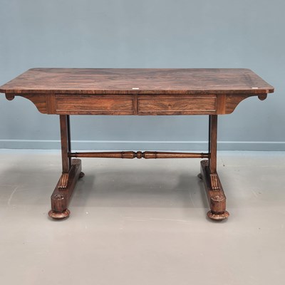 Lot 1634 - A 19th century rosewood writing table with two...