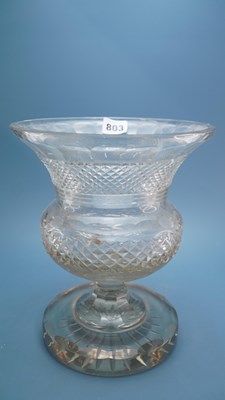 Lot 803 - A cut glass thistle shaped vase standing on a...