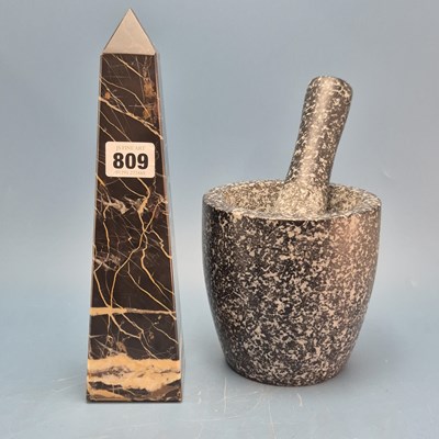 Lot 809 - A calcite streaked black limestone obelisk. ...
