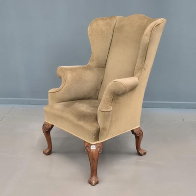 Lot 1657 - An antique Queen Anne style wing armchair with...