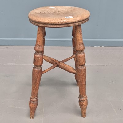 Lot 1670 - An oak stool, the slightly dished circular ...
