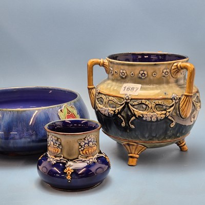 Lot 1687 - A Doulton stoneware three handled and footed...