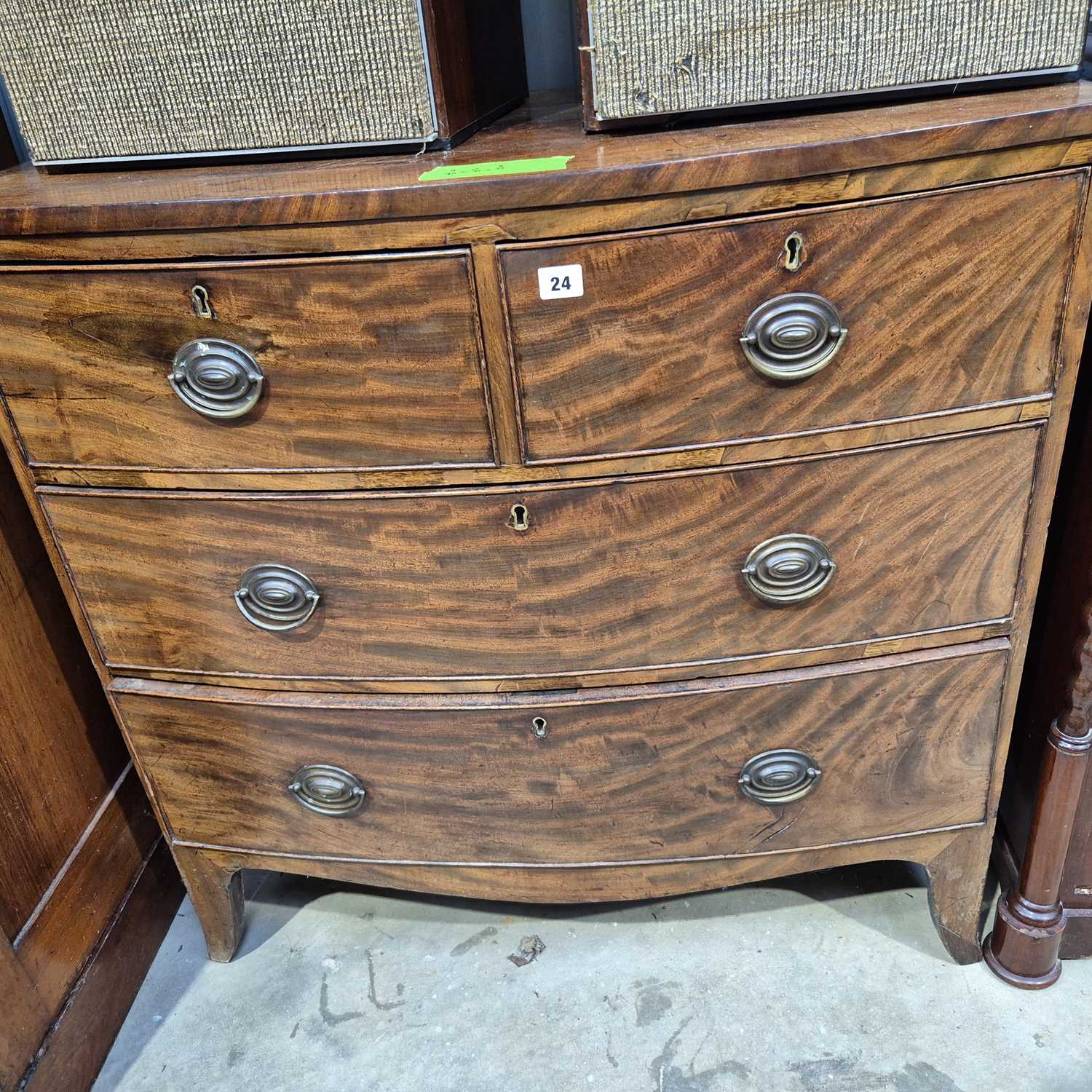 Lot 24 - A 19th century mahogany small bow front chest...