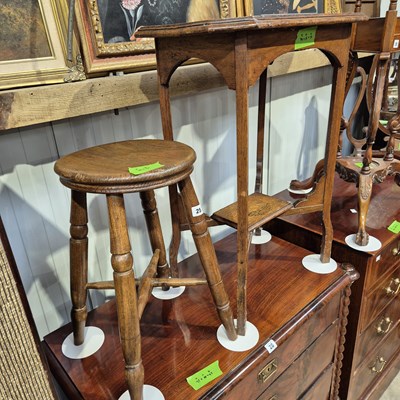 Lot 25 - A vintage penny top stool and an oak...