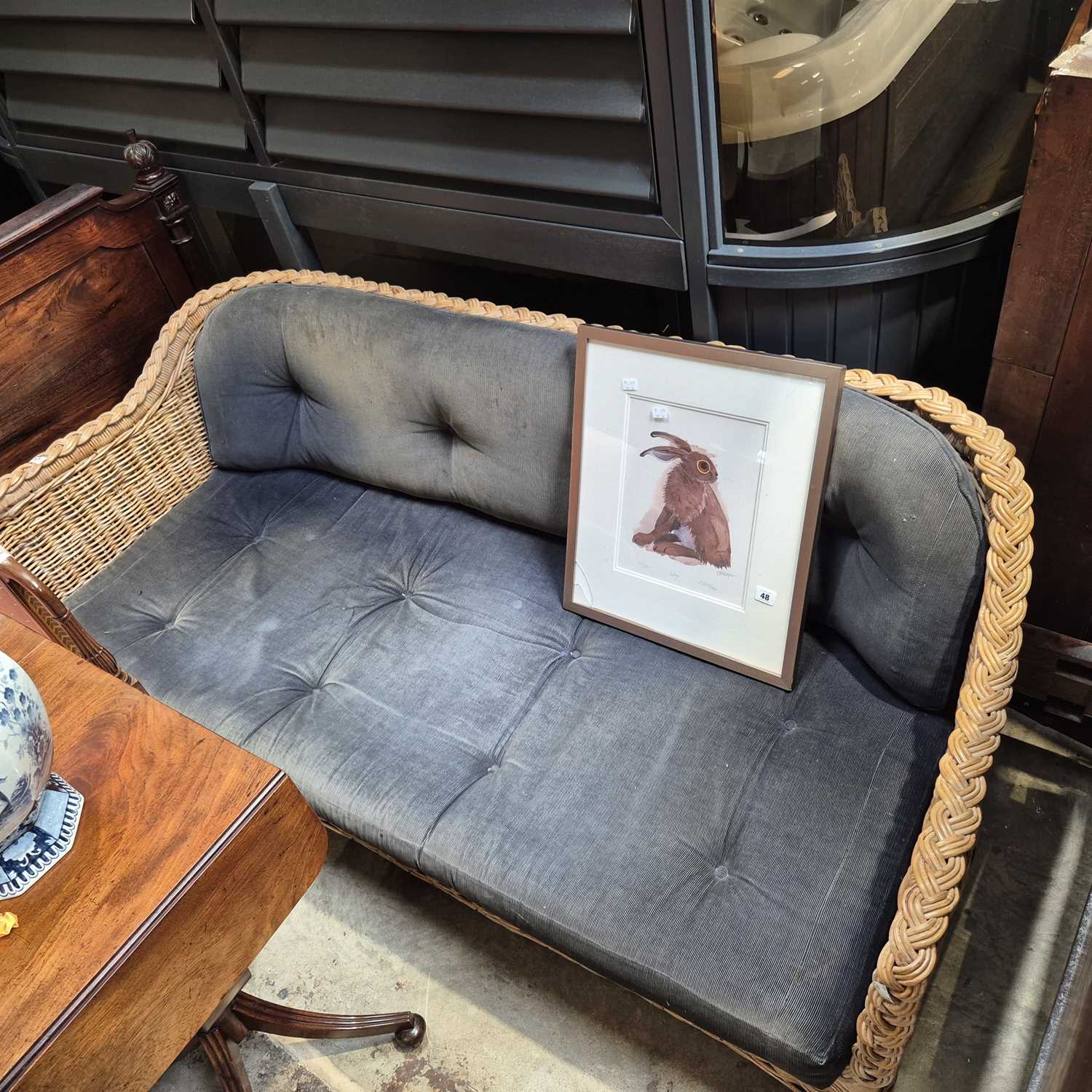 Lot 47 - A good quality rattan conservatory settee.