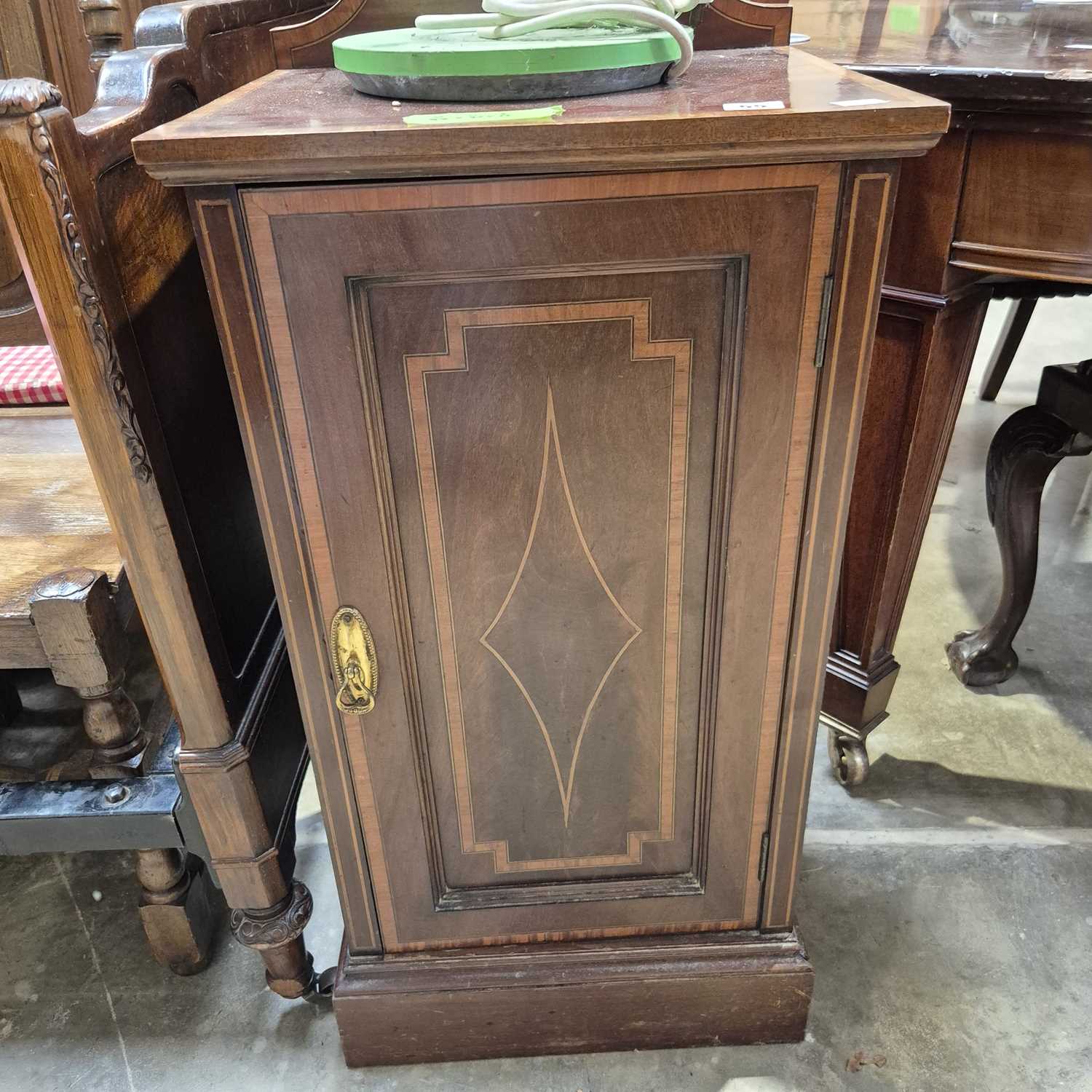 Lot 55 - An Edwardian mahogany inlaid bedside cabinet....